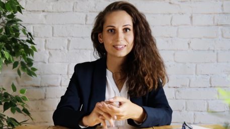 a professional woman sitting at her desk